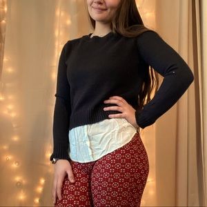 Black sweater with false button up on bottom